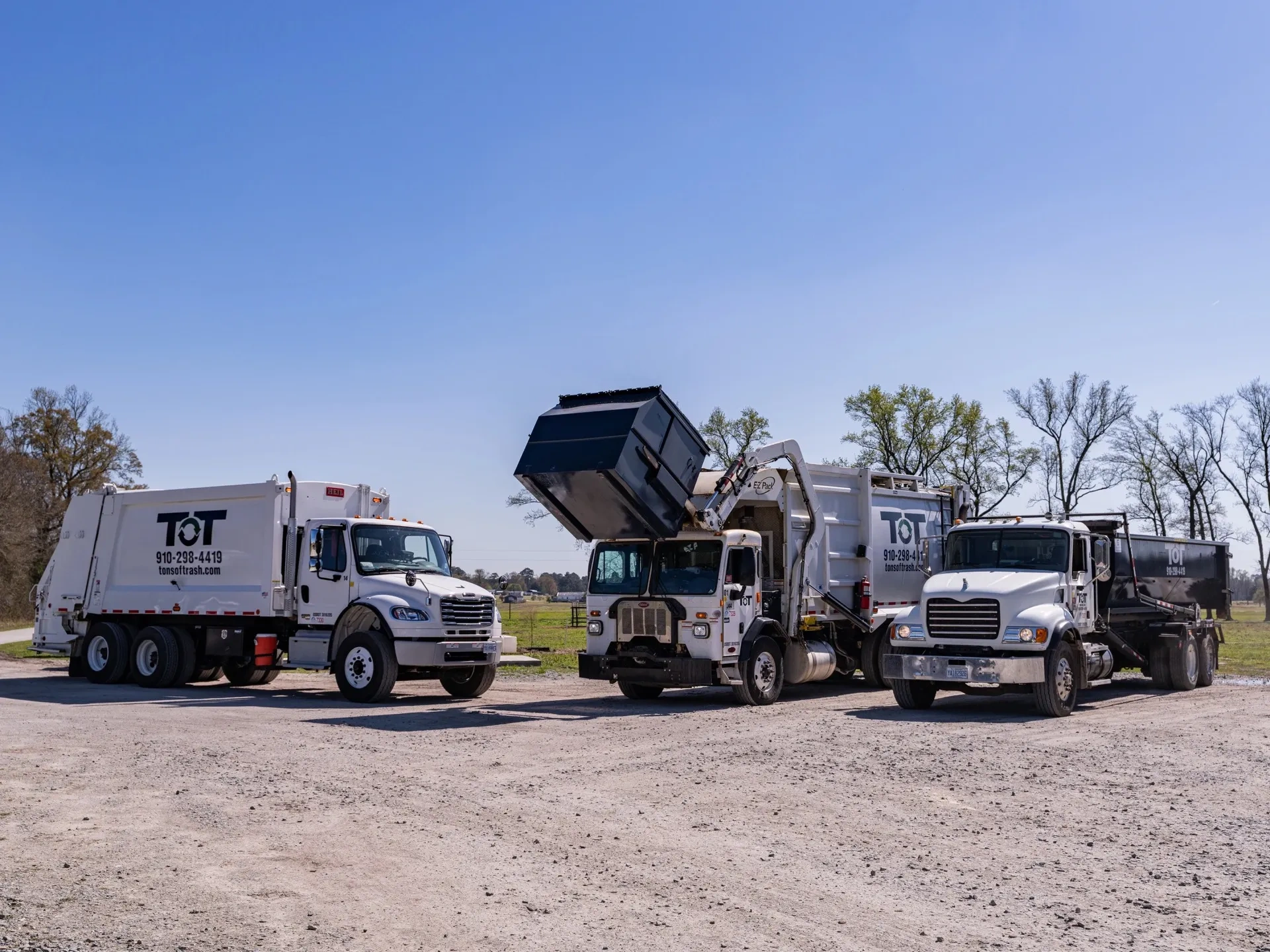 Tons of Trash fleet of waste management trucks lined up in eastern North Carolina